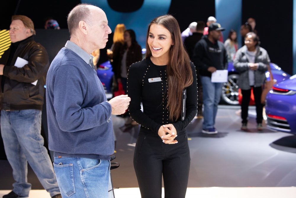 Auto Show Product Specialist talking to consumer