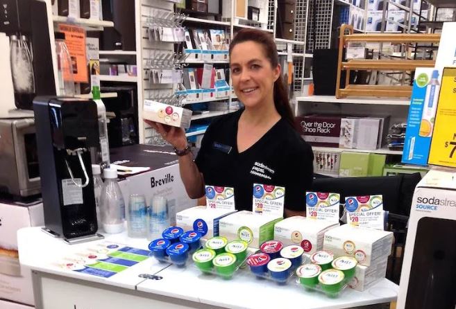 In-store demonstrator handling product for retail customers to increase ROI of the brand