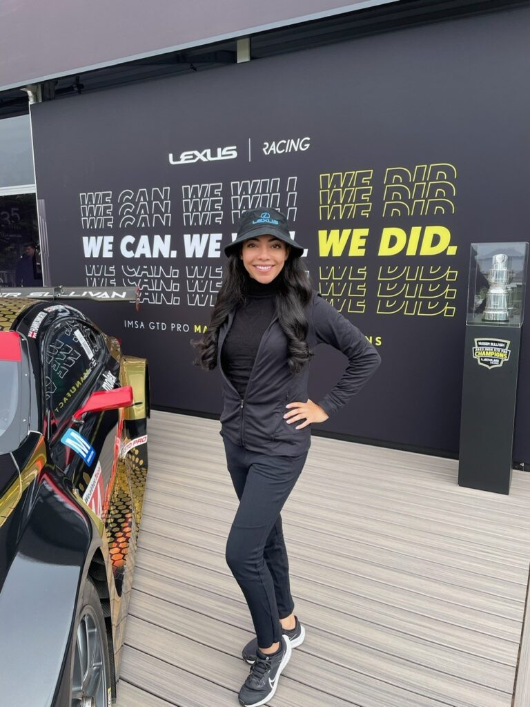 Lexus product specialist in front of display at Pebble Beach Concours d'Elegance