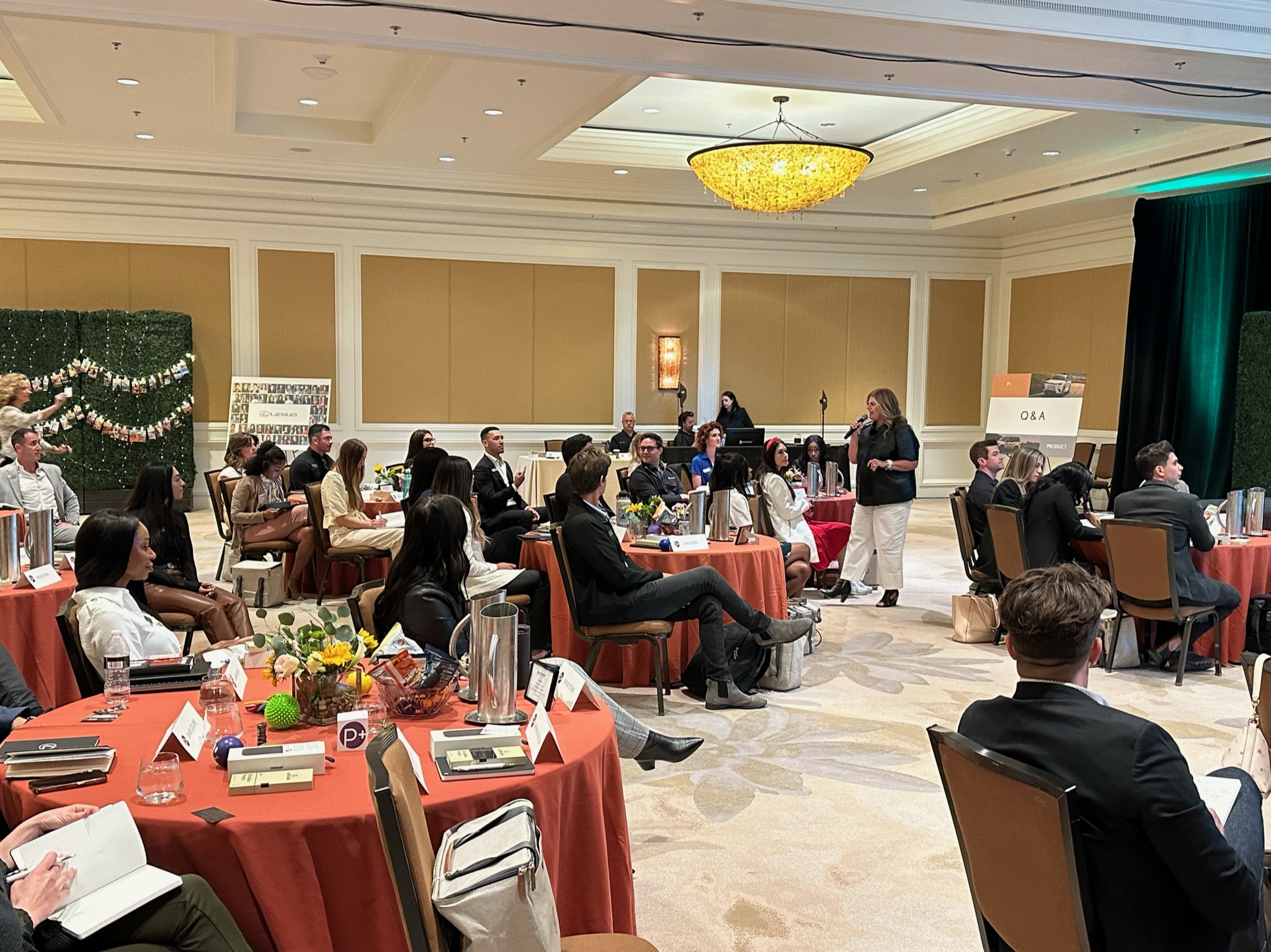 Group of Product Specialists attending Lexus product training in a hotel ballroom